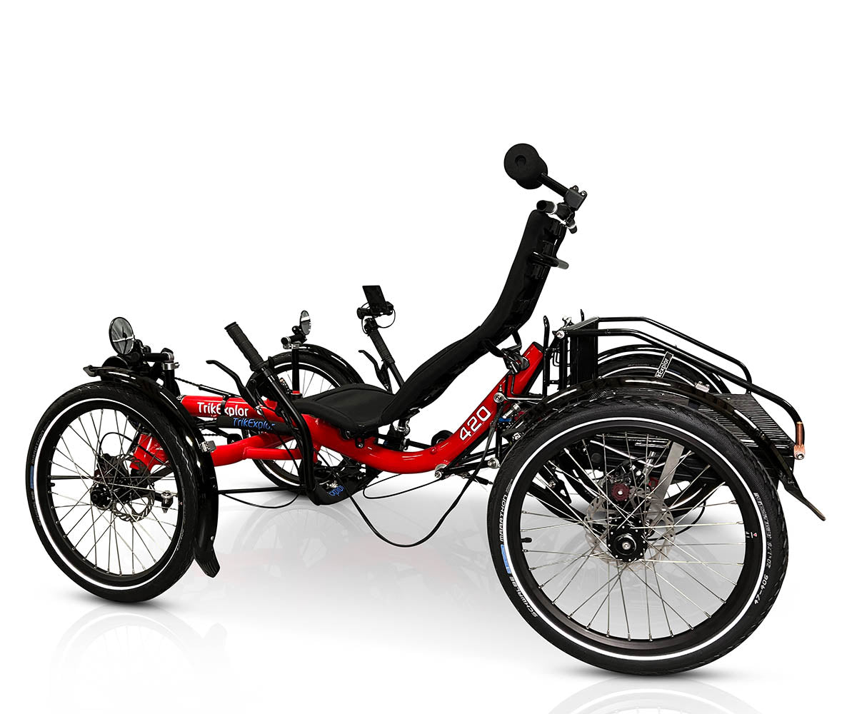 Side view of the TrikExplor 420e quad featuring a red frame, black ergonomic seat, rear cargo rack, and touring tires.