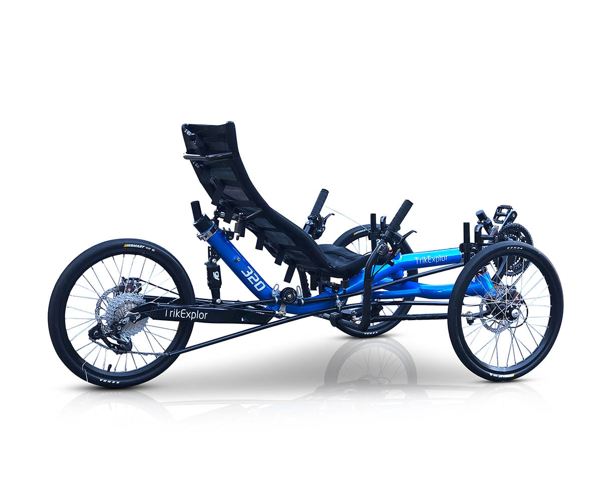 TrikExplor 320e tadpole tricycle, rear angle side view with a reclined seat position, showing the full length of the frame and wheels.
