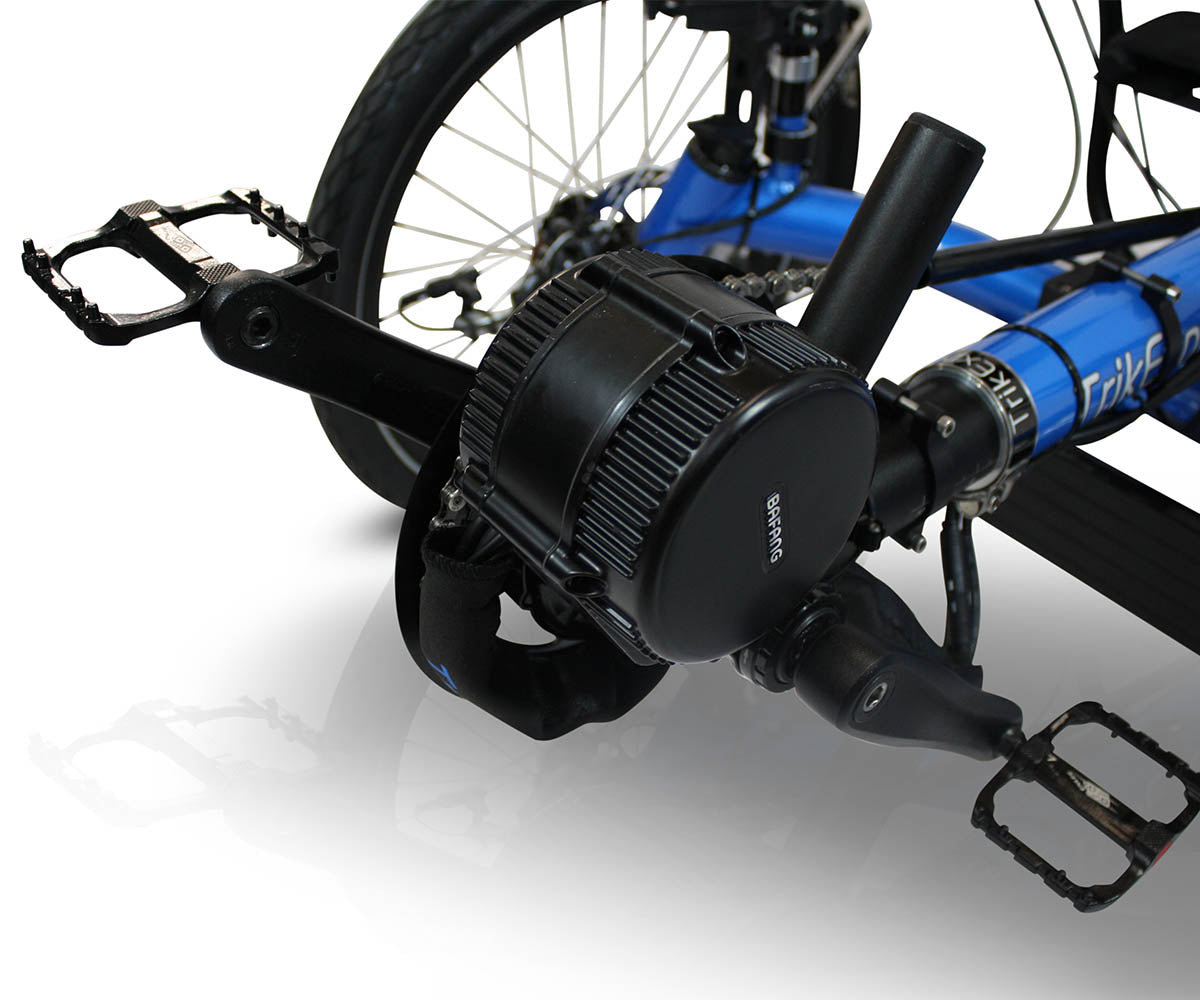 Close-up of the TrikExplor 320e's front crankset and 500W Bafang motor, highlighting the pedal assist mechanism.