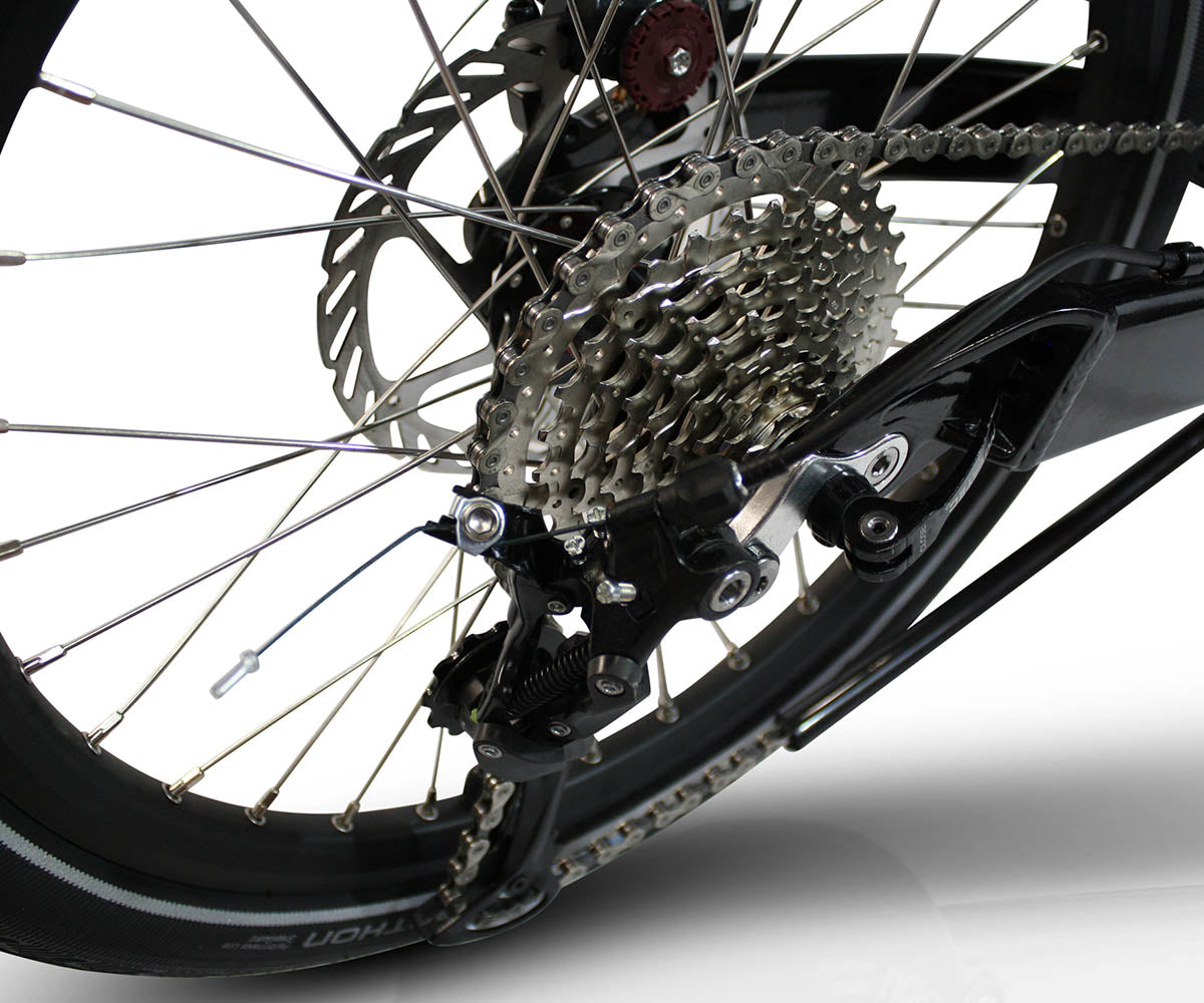 Close-up of the TrikExplor 320's rear drivetrain, showcasing the Alivio component package and adaptive 3x9 gearing system.