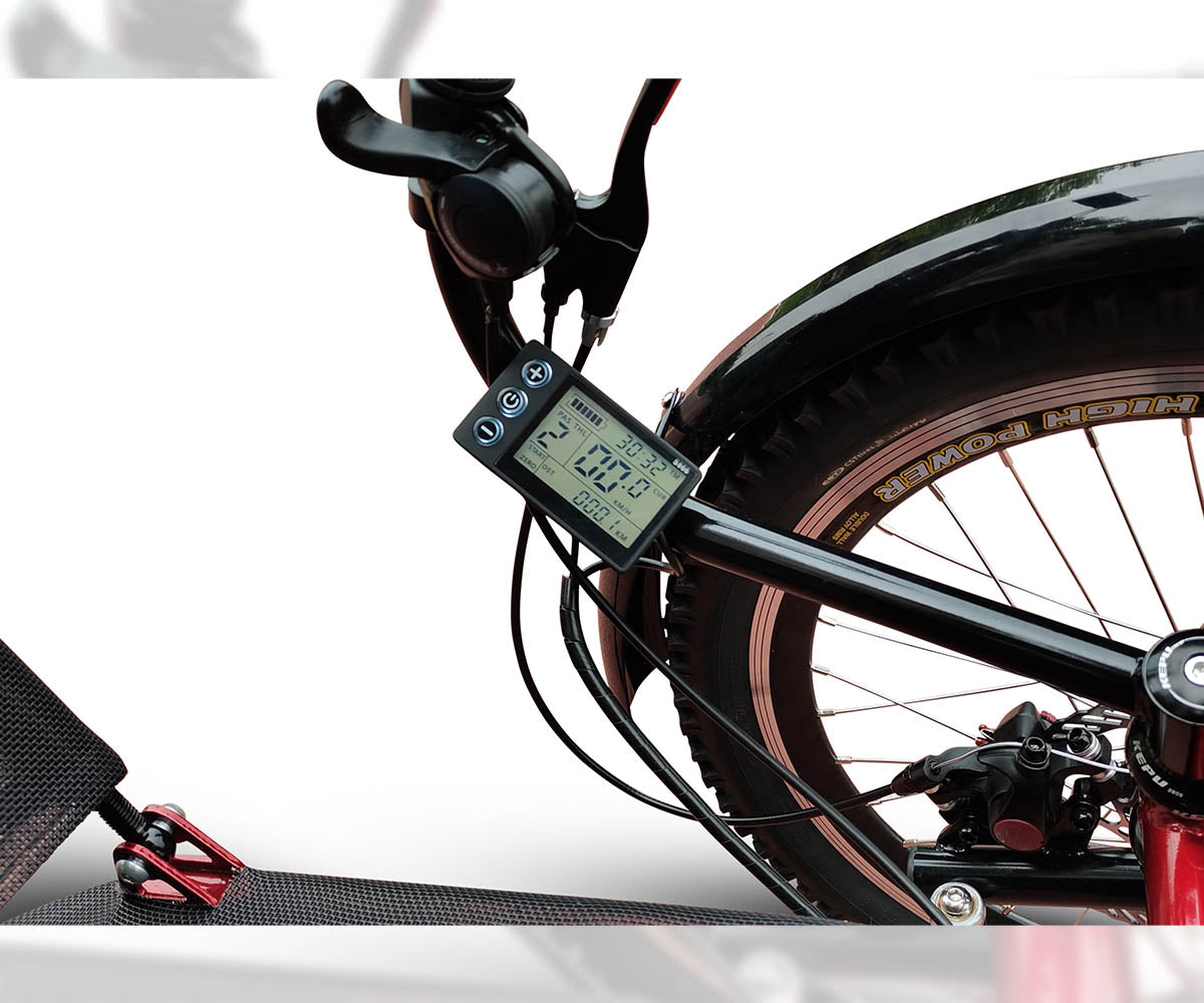 Close-up of the DuraTrike RT3e's display screen mounted near the handlebars, showing battery level, speed, and other ride metrics.