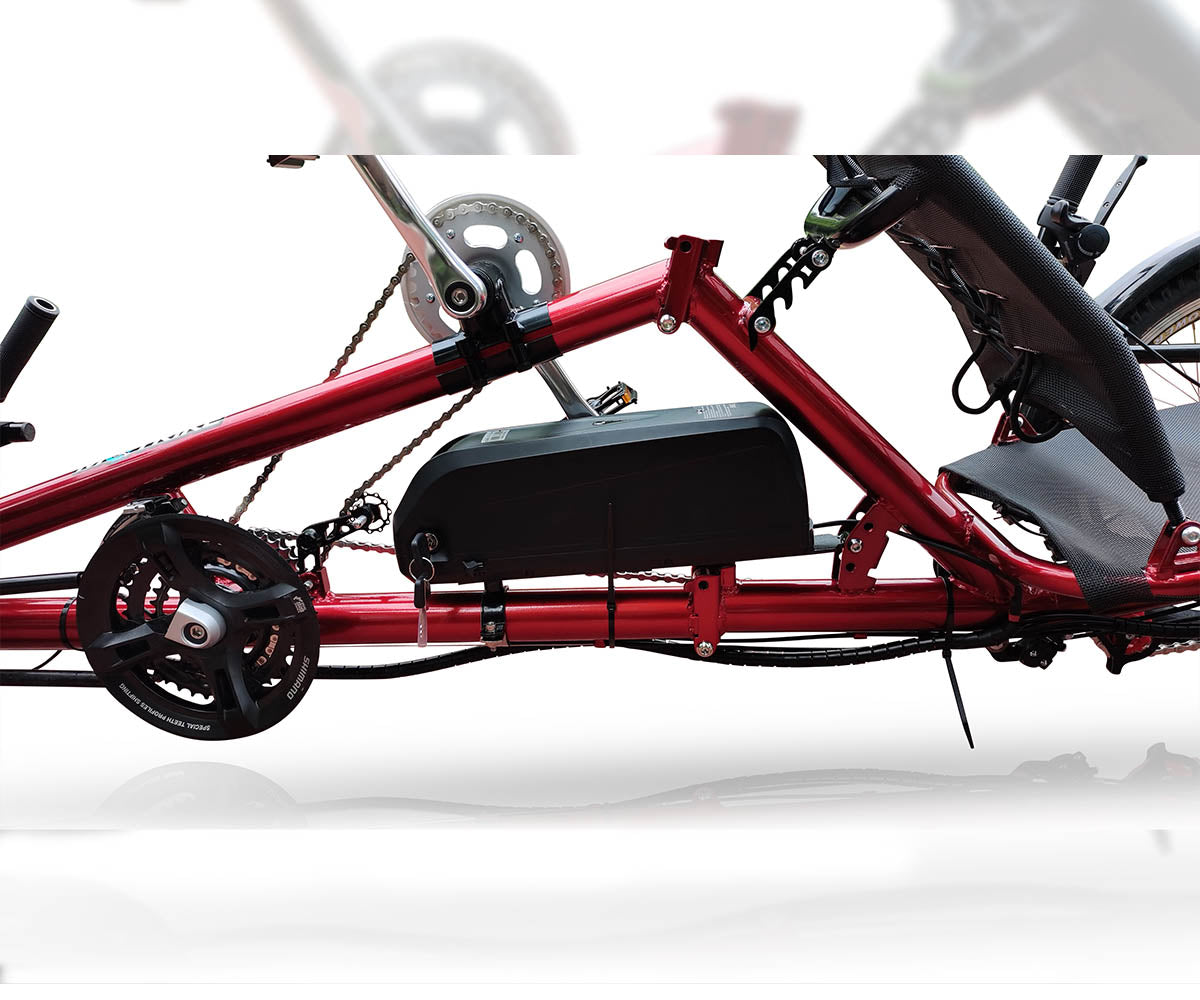 Side view of the DuraTrike RT3e's mid-section, highlighting the battery placement on the frame, along with the drive chain and rear chainring set.