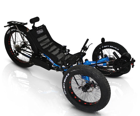 TrikExplor F326e tadpole trike with blue frame, three fat tires, and a reclining mesh seat with headrest. Front angled view.