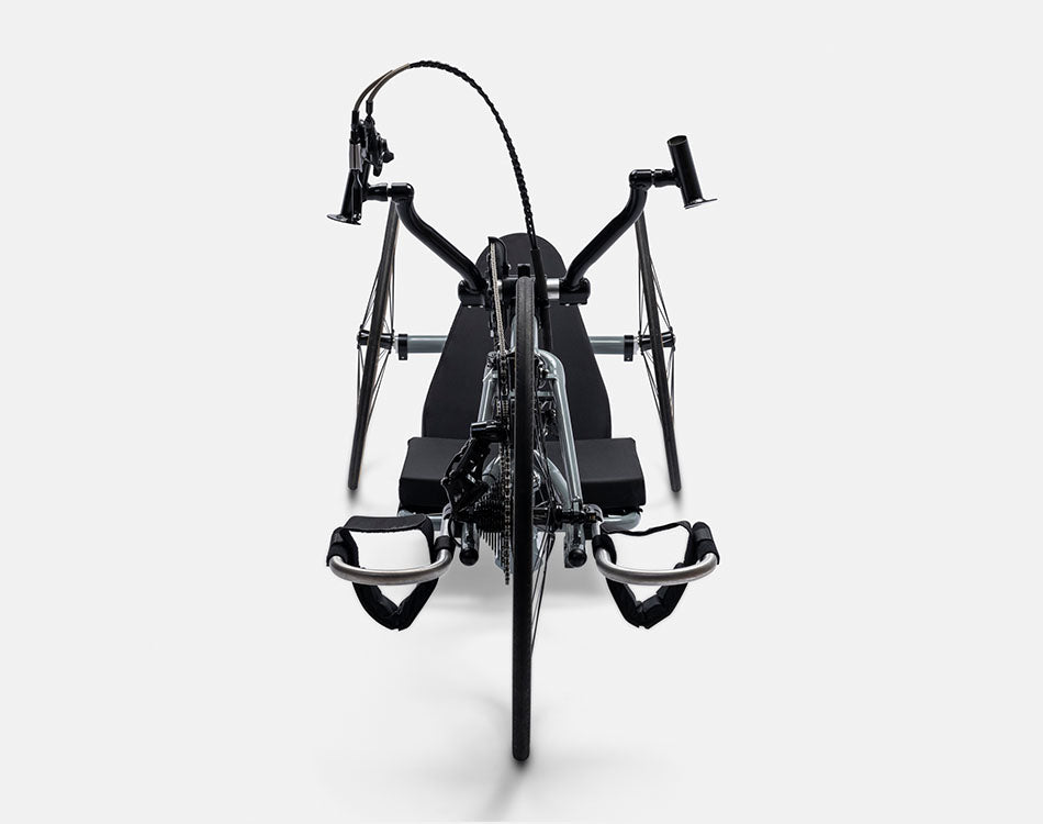 Front view of a Top End Force G handcycle with a black seat, three wheels, and hand pedals.