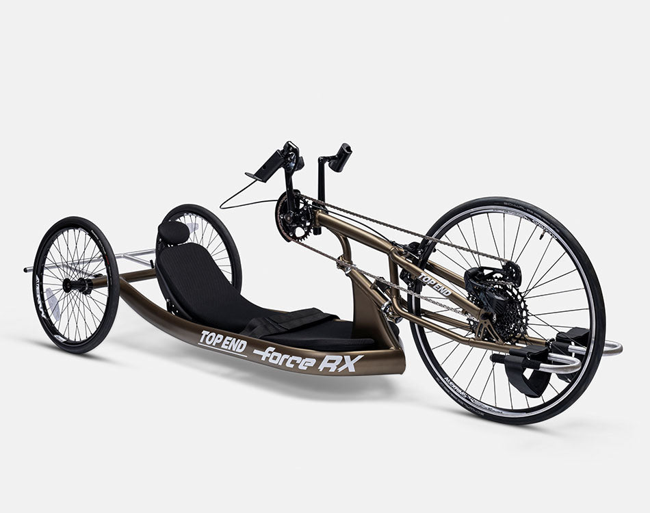 Side view of a Top End Force RX handcycle with a recumbent black seat and three wheels.