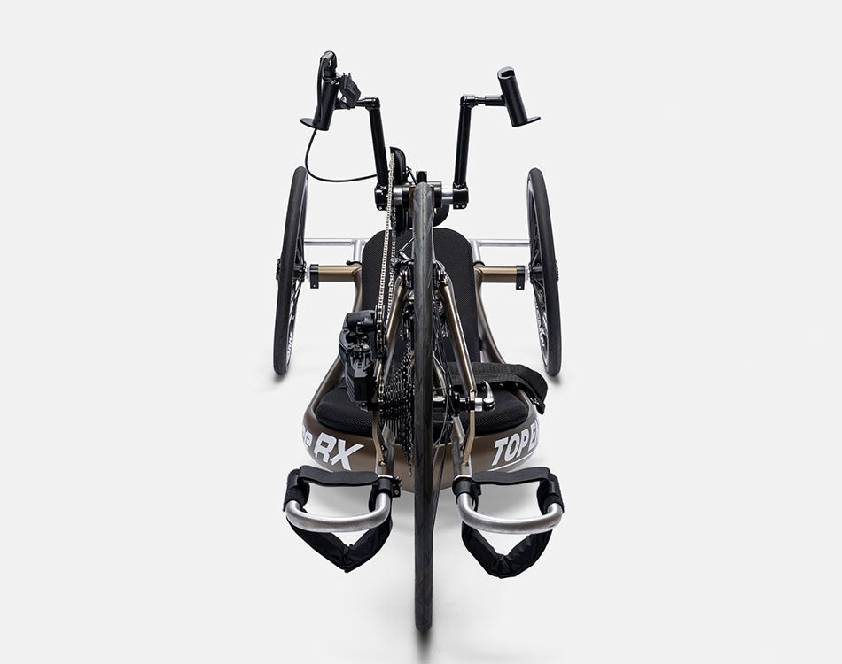Front view of a Top End Force RX handcycle displaying strapped feet rests and front wheel gear shifter package.