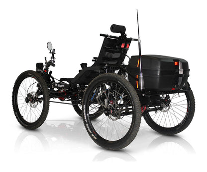 Angled rear view of the TrikExplor 424e recumbent quad with all-terrain tires, black mesh seat, rear cargo box, and rear view mirrors.