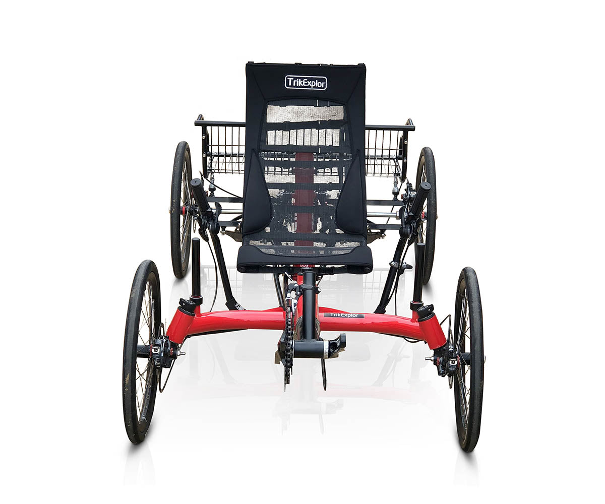 Front view of the TrikExplor 420 quadricycle with red frame and mesh seat with rear gears and shifter package visible though fabric