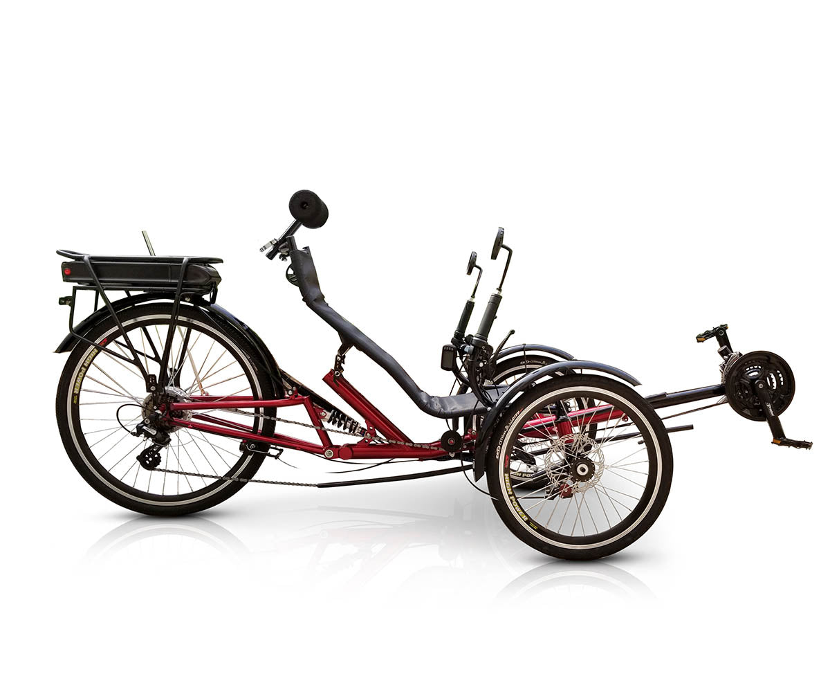 Side view of a TrikExplor FT36e red recumbent trike with black seat and three wheels, demonstrating rear suspension