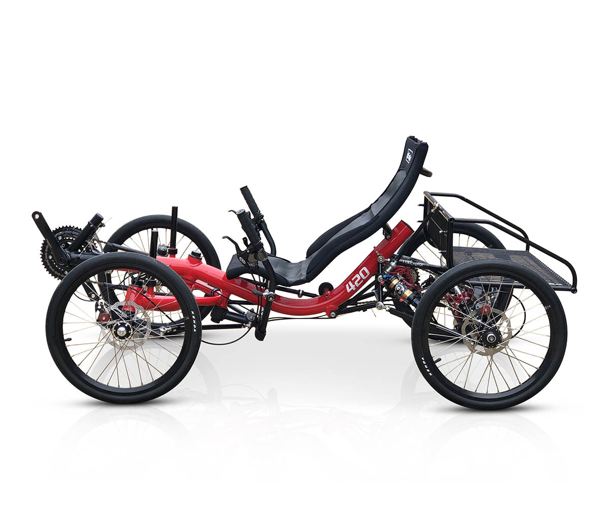 Side view of the TrikExplor 420 quad bike with red frame, black ergonomic seat, showing 20-inch touring tires & missing pedals