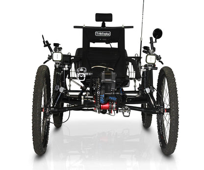 Front view of the TrikExplor 424e recumbent electric assist quad with all-terrain tires, headlights, mirrors, and a black seat with headrest.