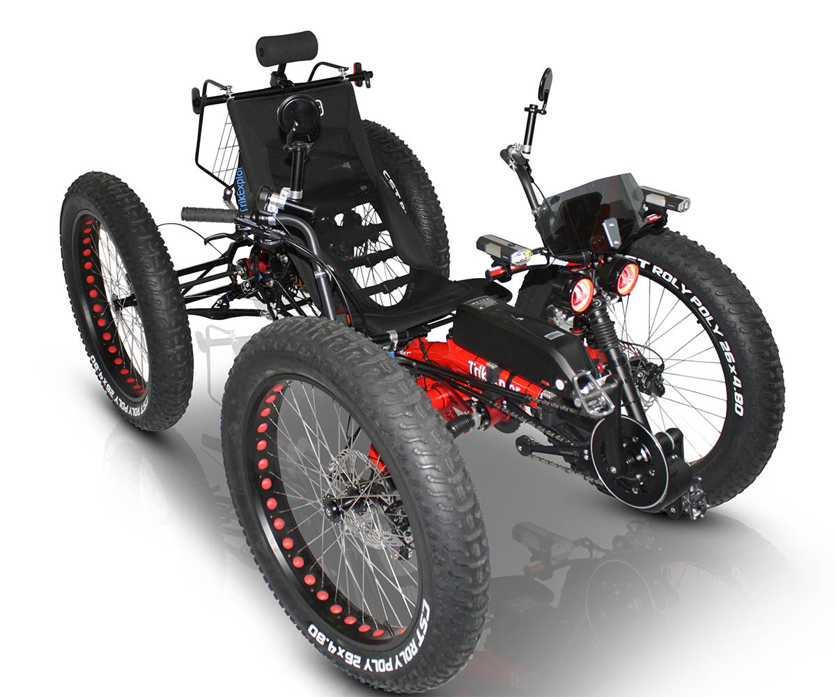 Front angled image of TrikExplor F426e showing offroad tires, headlights, and electric assist hardware integrated with the front crankset. 