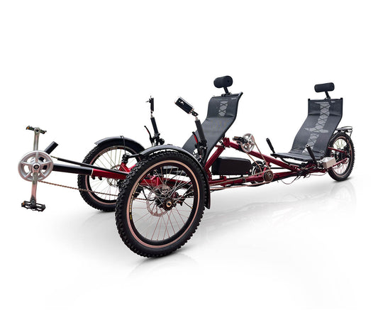 DuraTrike RT3e tandem trike in red, front right angled view, showing the dual seat arrangement and sturdy steel frame designed for two riders.