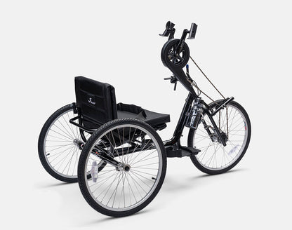 Angled rear view of a Top End Excelerator handcycle with a padded seat, hand pedals, and three large all-terrain wheels.